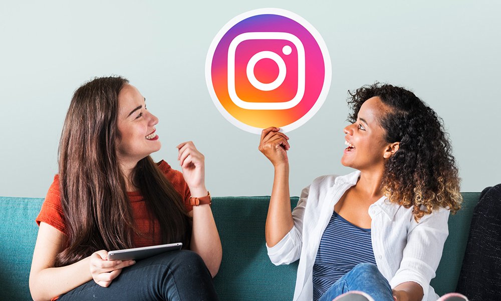 two girls are having friendly conversation and enjoying