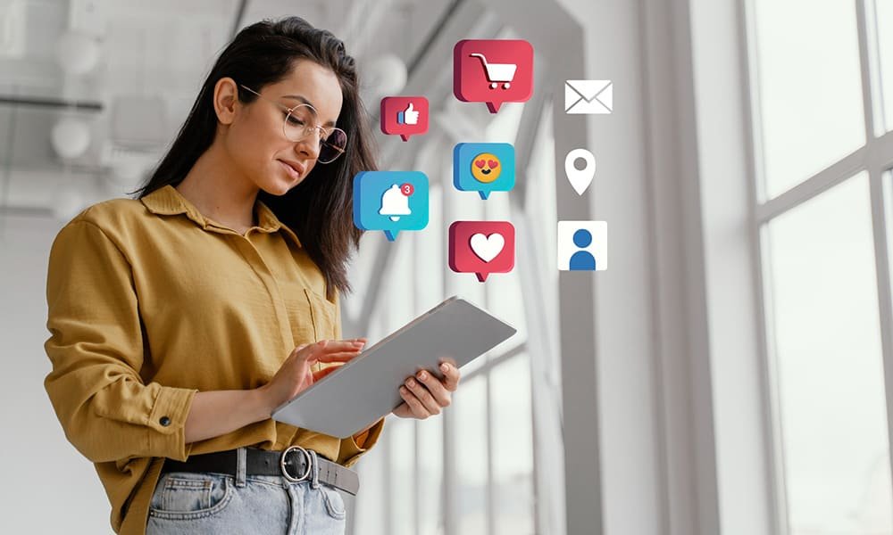 a girl is working on tablet and using social media